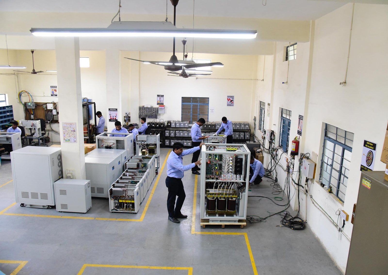 Fujitronix India Pune manufacturing floor with technicians assembling power backup systems